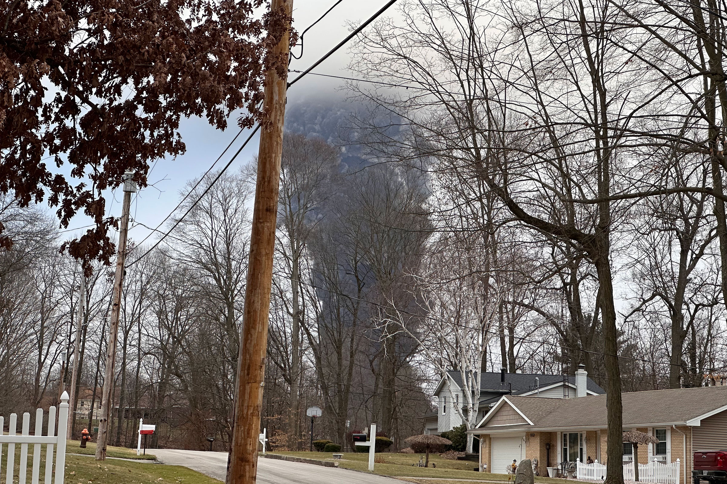 Released chemicals rise from the ground like a mushroom cloud in a residential neighborhood.