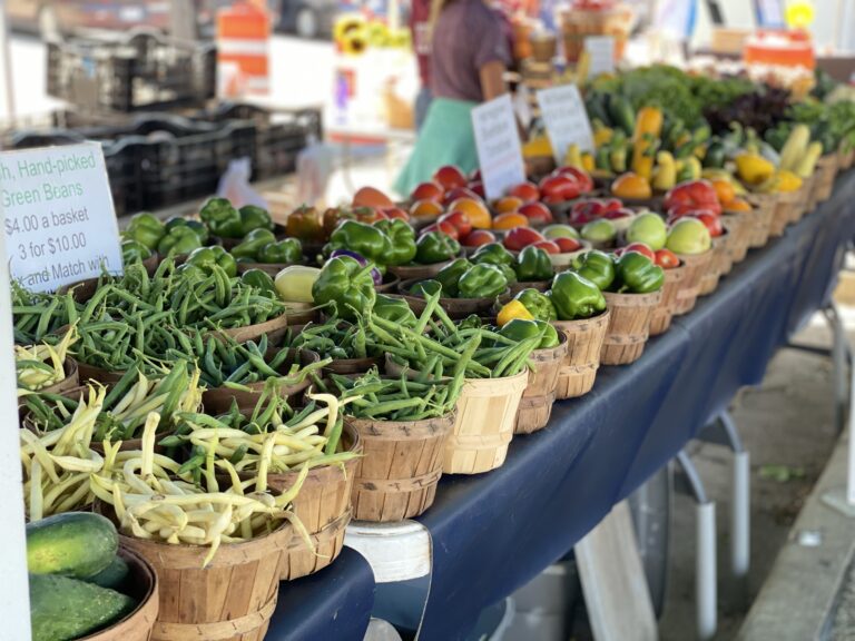 farmers market photo of vegetables in little baskets