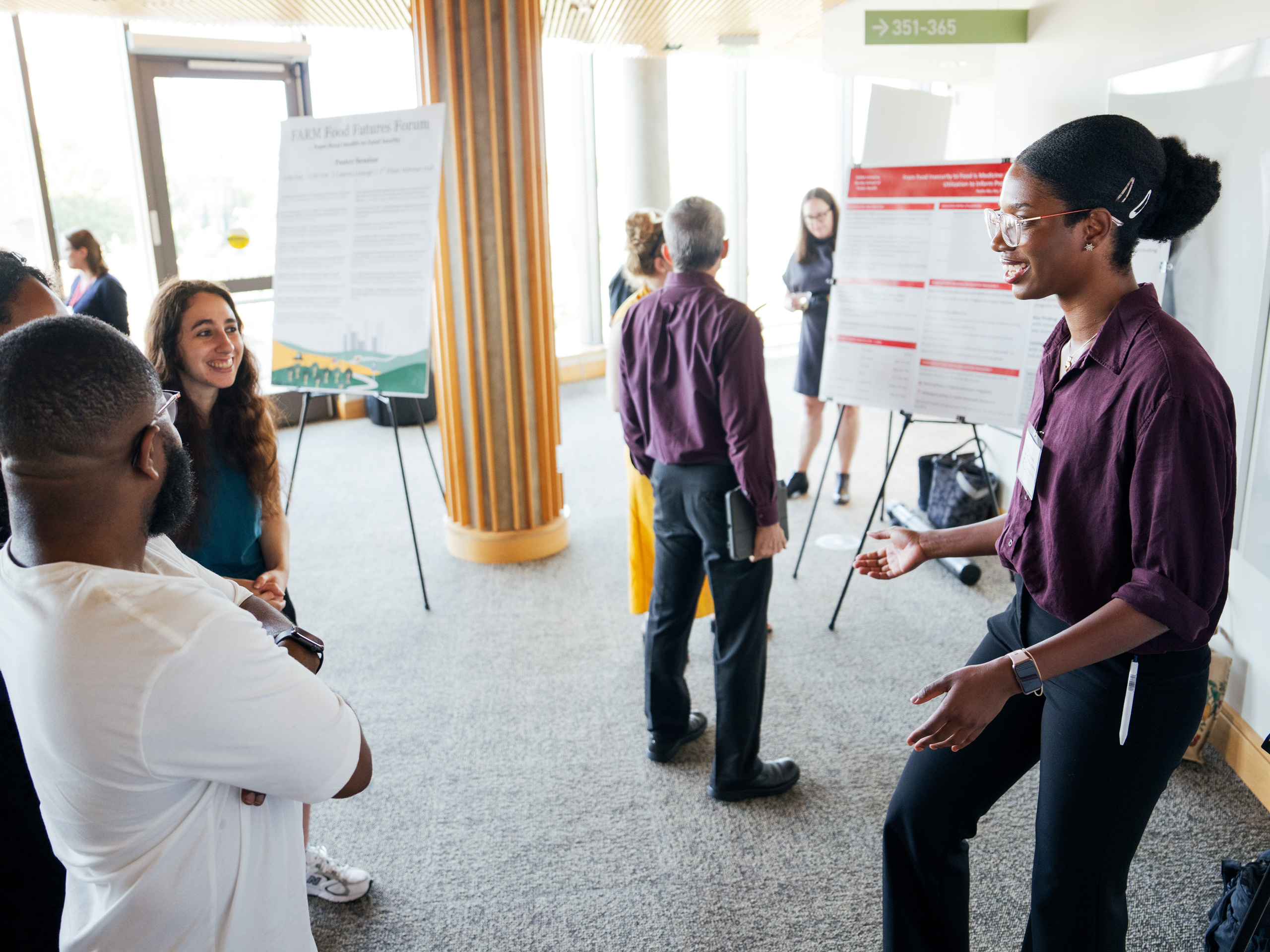 Emmanuella Agyeman, right, presents her research on systems that track foodborne illness as part of the FARM Food Futures Forum: From Rural Health to Food Security on Tuesday, Oct. 13, 2026, at WashU in St. Louis.